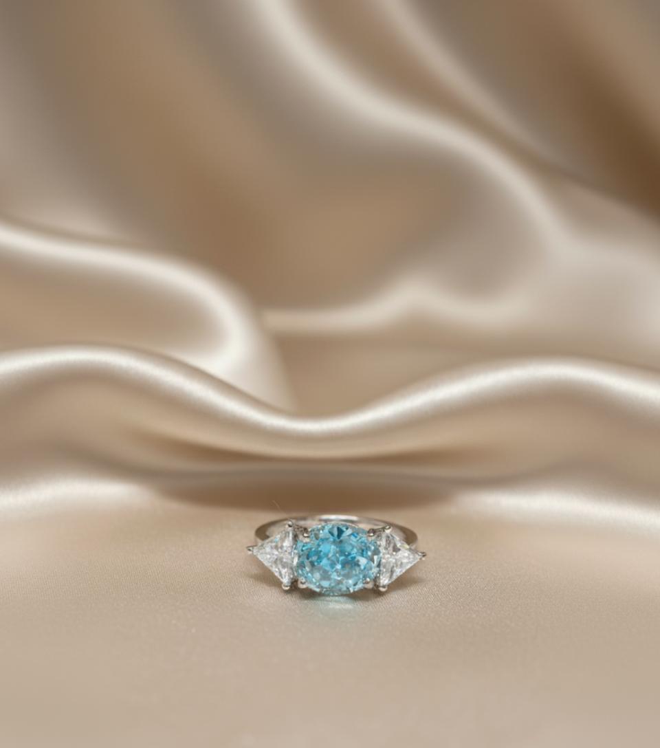 Blue Oval Cubic Zirconia And Trillion Accent Three-Stone Ring